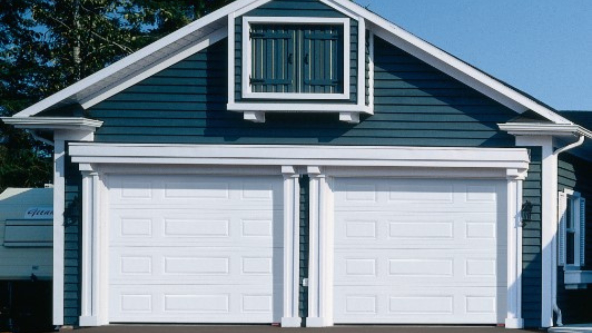 A house with two insulated garage doors 