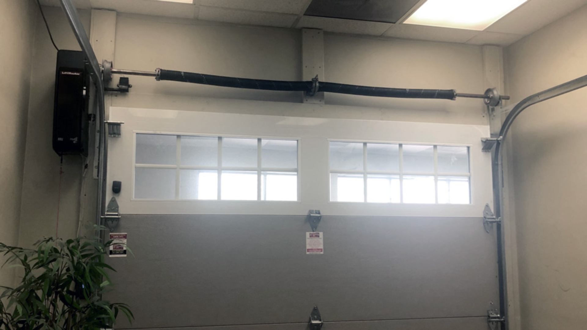 garage doors openers A garage door with a jackshaft opener