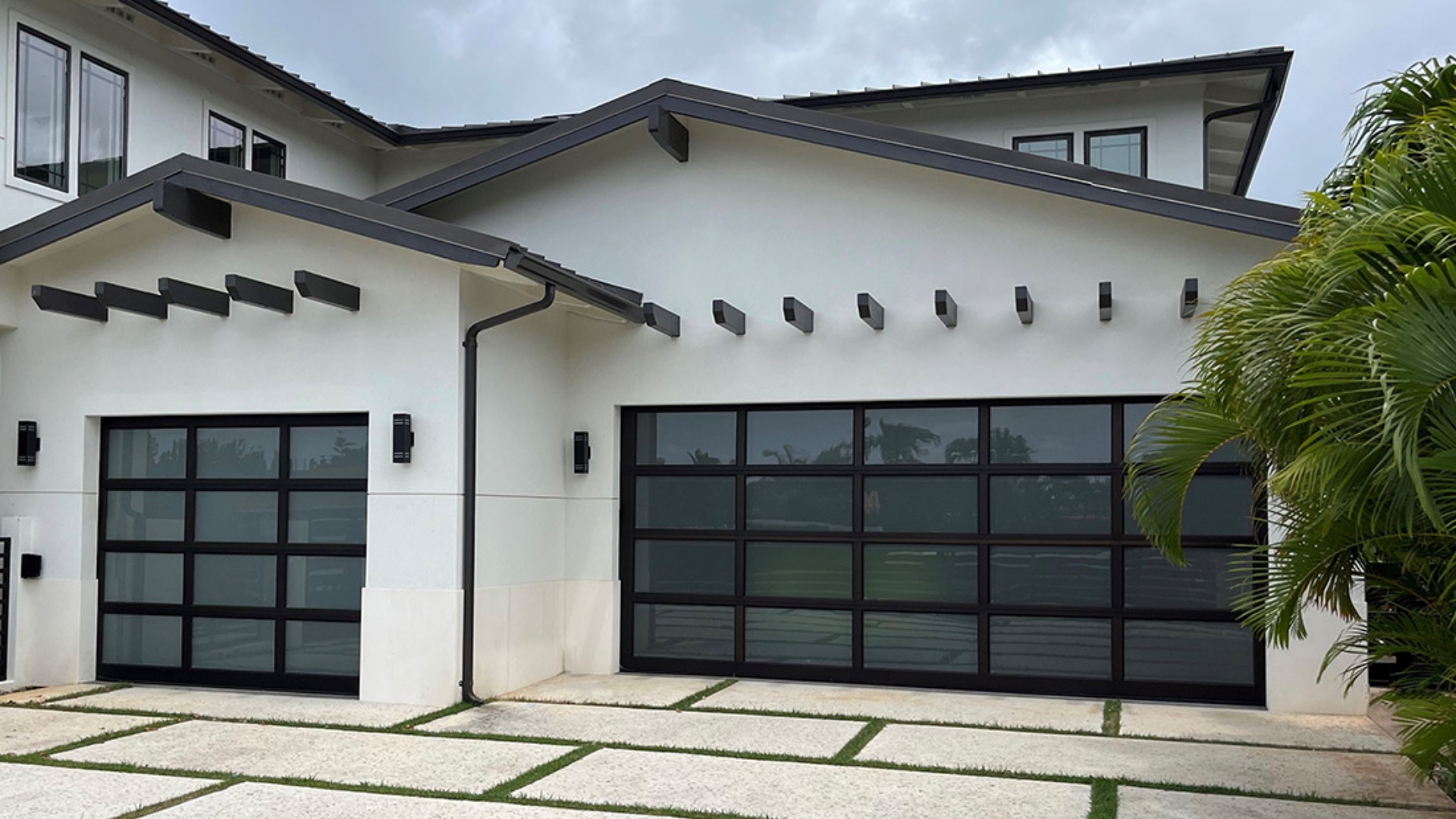 A house with glass panel garage doors