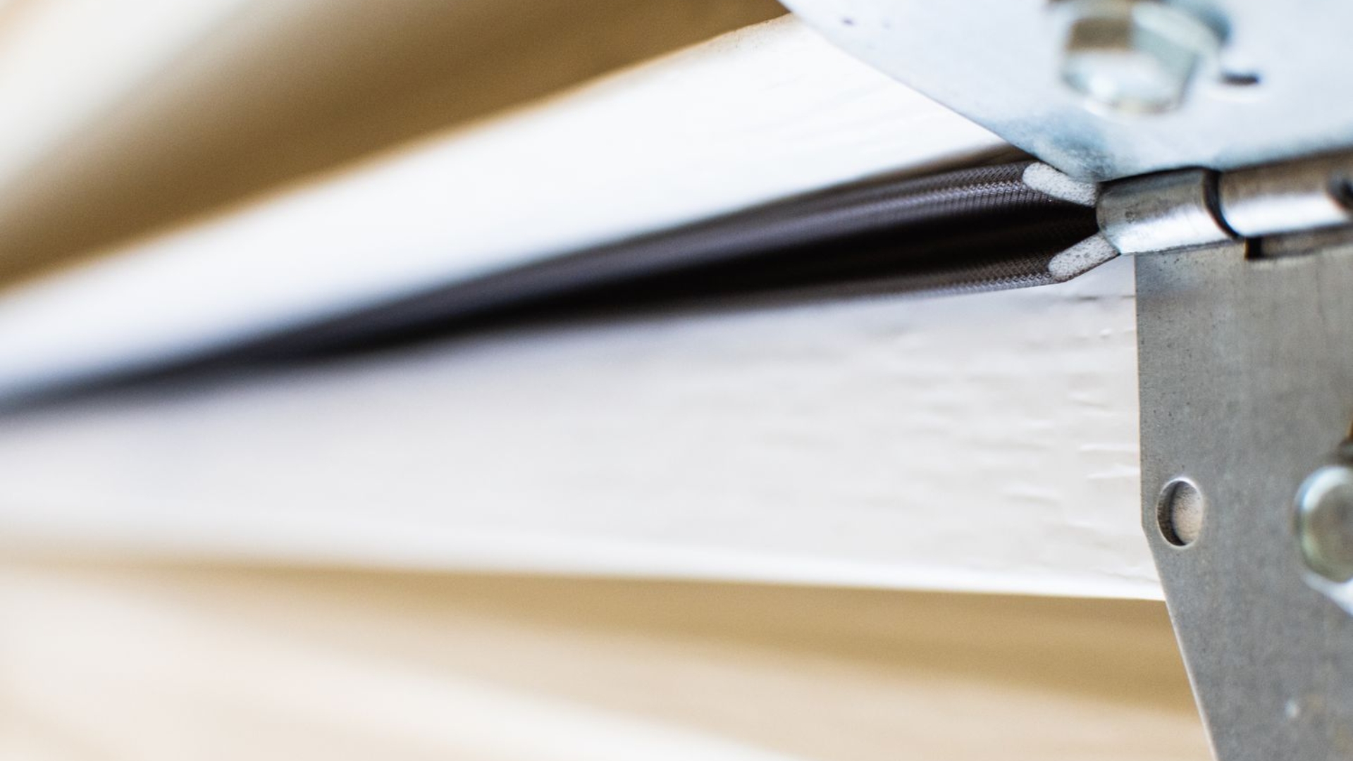 Weatherstripping in between garage door panels