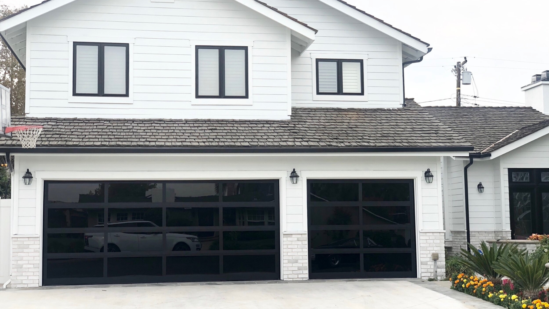 A house with glass garage doors