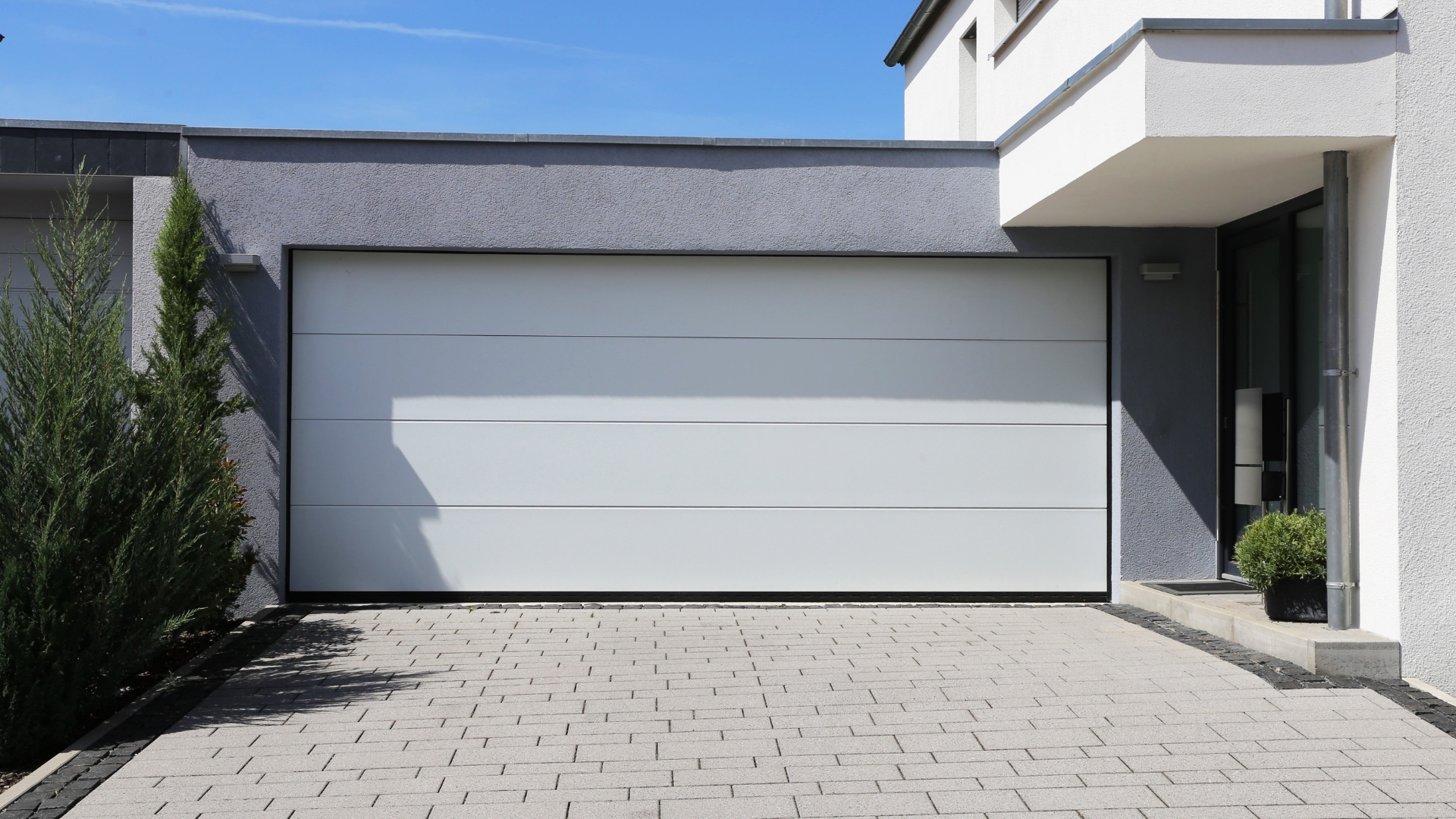 A house with one of the most common types of garage doors: steel garage door