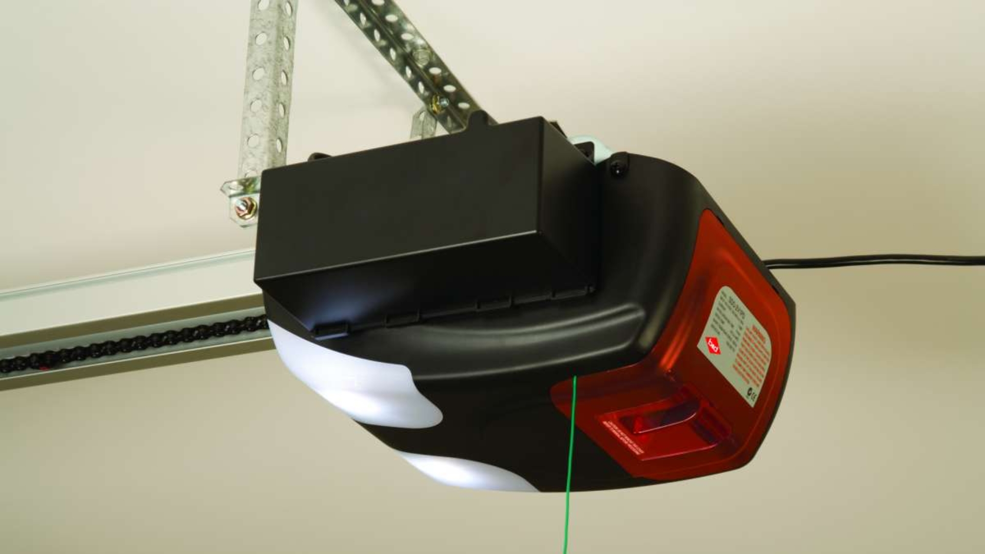 Battery backup installed on a garage door motor unit.