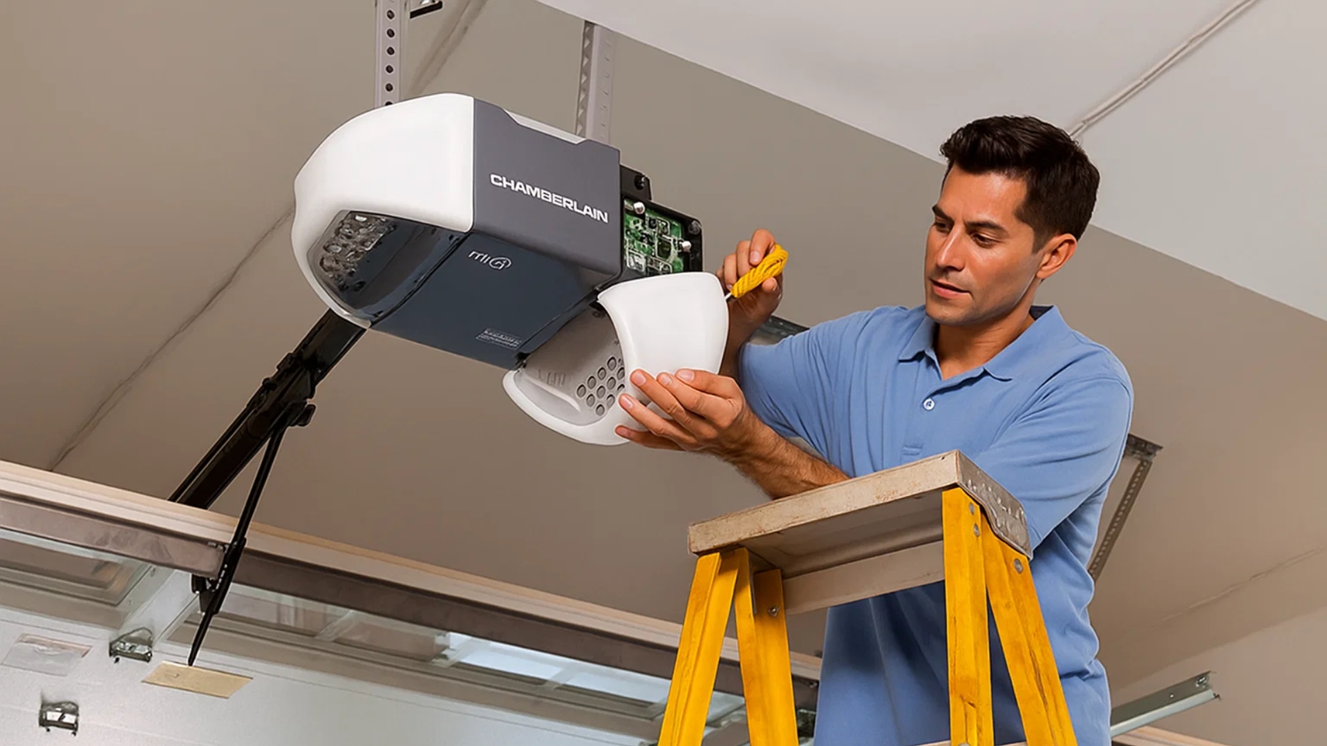 Technician performing Chamberlain garage door opener setup