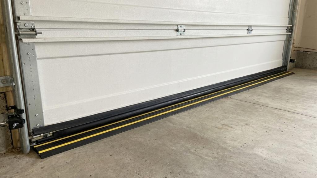 Garage door bottom seal installation for weatherproofing