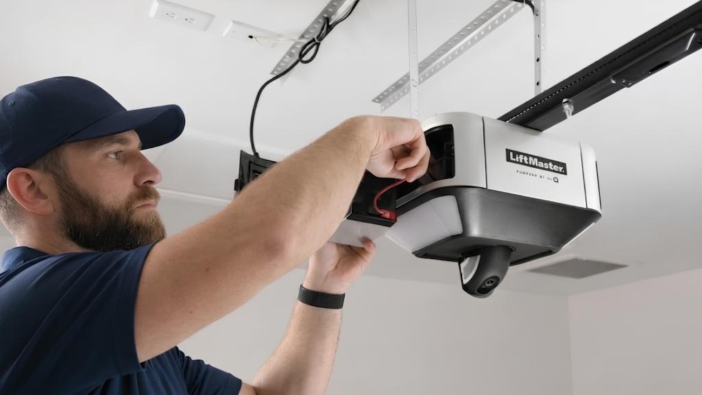 Licensed technician in Valley Village installing a LiftMaster garage door opener inside a residential garage